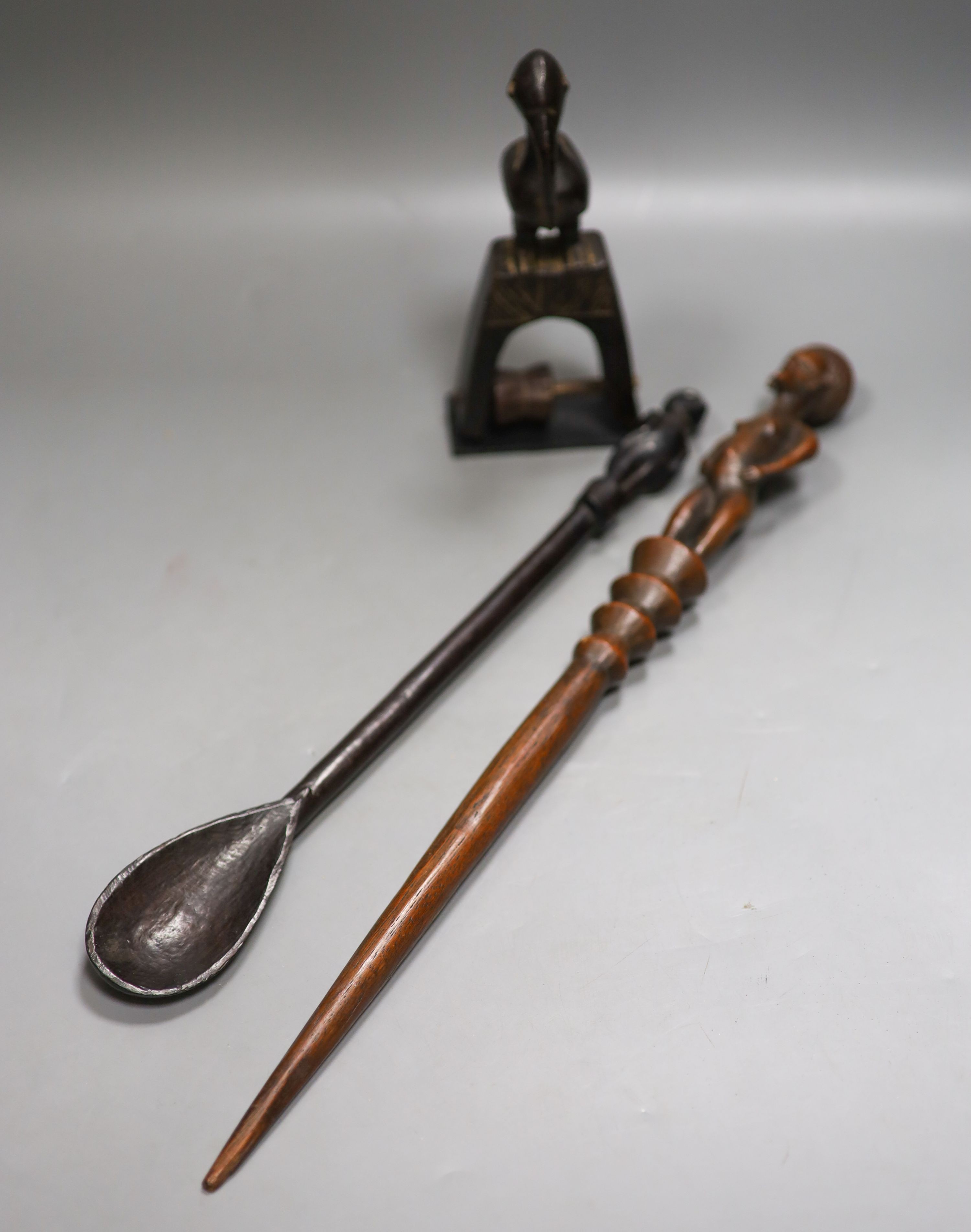 Senufo tribal pulley, a wood ladle believed to be Senufo, and a wood baton, believed to be Chokwe tribe 49cm